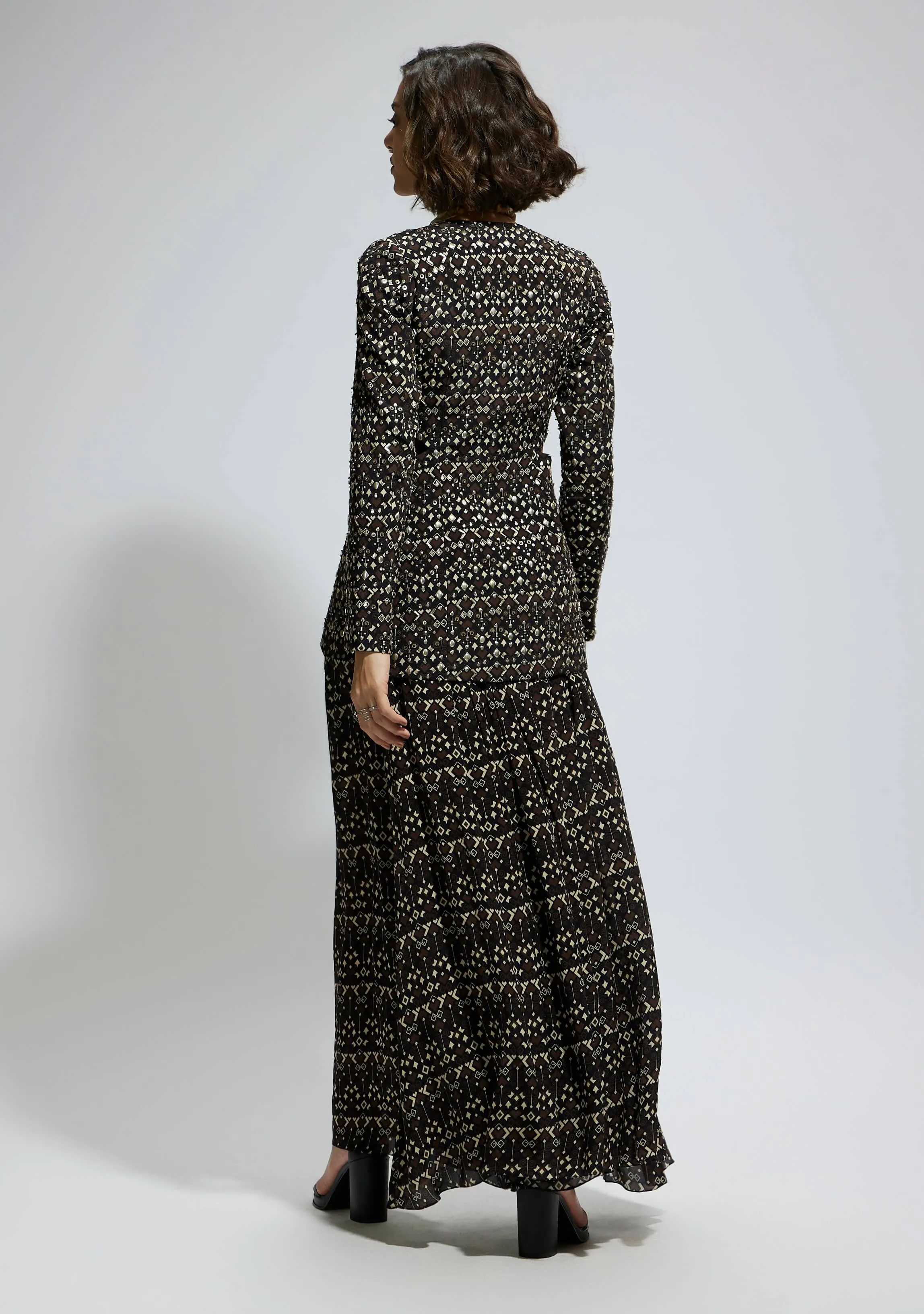 Black embellished jacket and printed flared pants