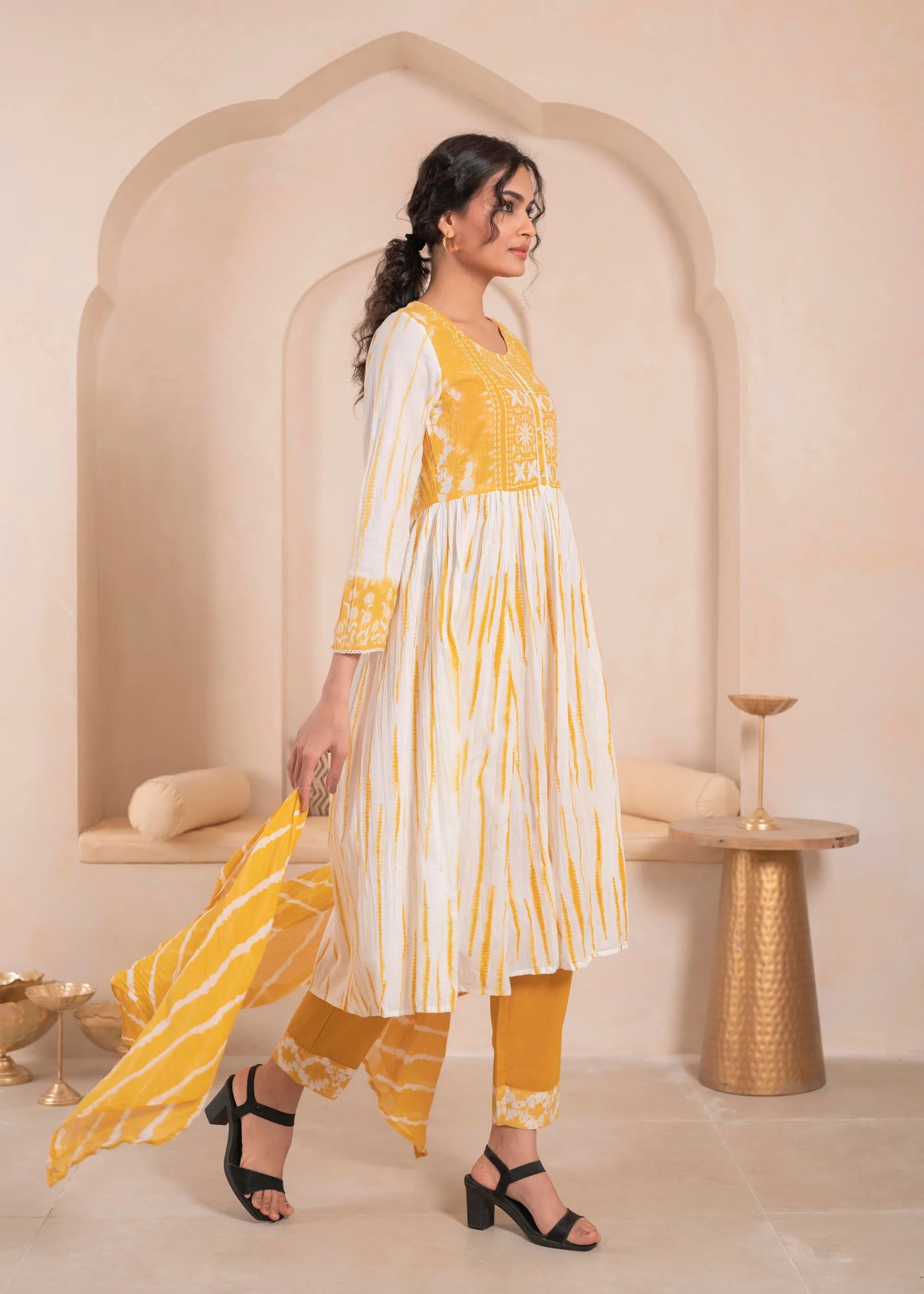 Mustarad and white kurta , solid bottom and tie - dye dupatta with cotton lace , buttons , sequince